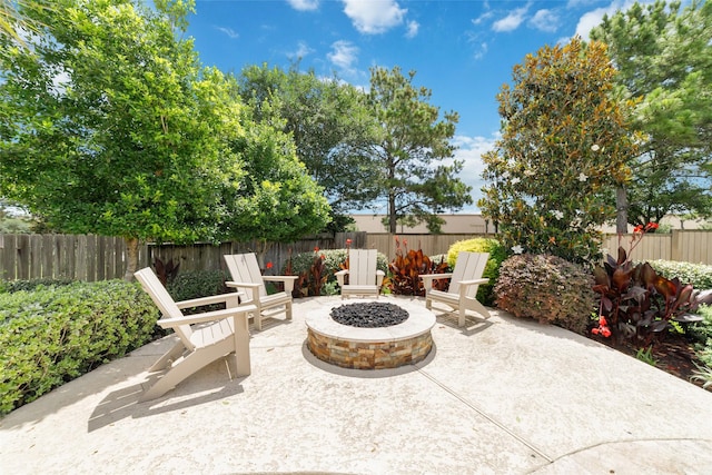 25303 Hall Meadow Ln, Katy, TX 77494 - fenced backyard featuring a patio and a fire pit
