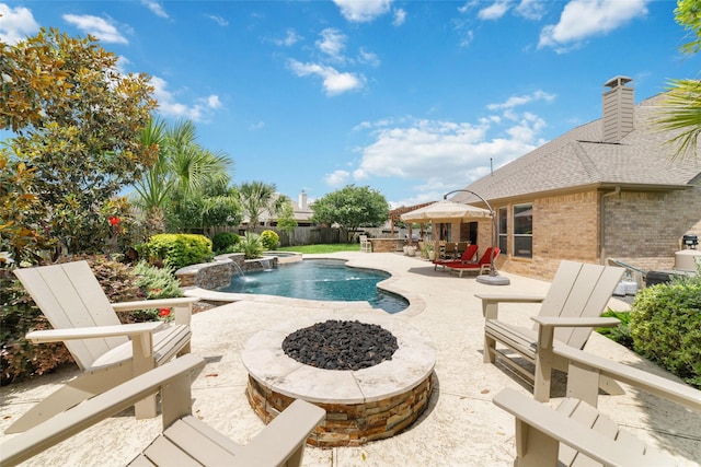 25303 Hall Meadow Ln, Katy, TX 77494 - view of swimming pool with a patio area, a fenced backyard, and a fire pit