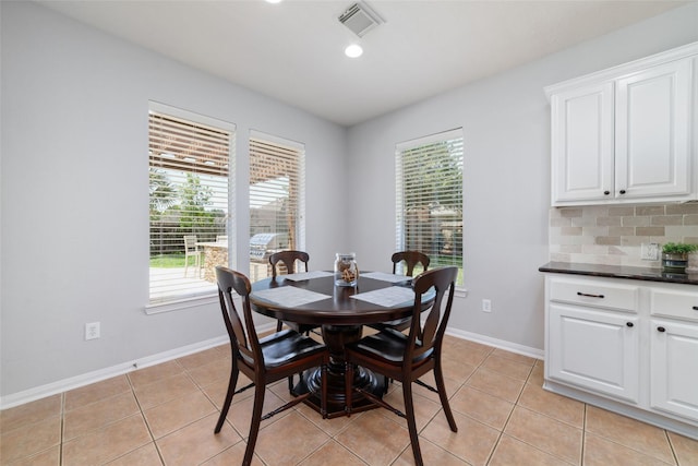 25303 Hall Meadow Ln, Katy, TX 77494 - dining area with light tile patterned floors, baseboards, and recessed lighting