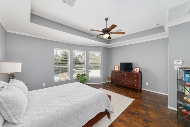 25303 Hall Meadow Ln, Katy, TX 77494 - bedroom with a tray ceiling, wood finished floors, baseboards, crown molding, and a ceiling fan