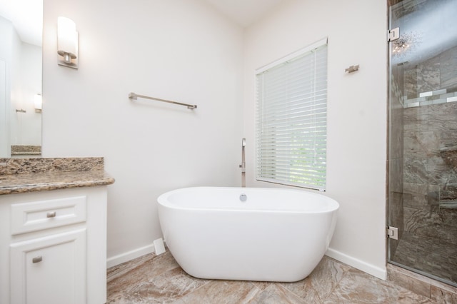 4311 Childress St, Houston, TX 77005 - full bathroom featuring a freestanding bath, a shower stall, and baseboards