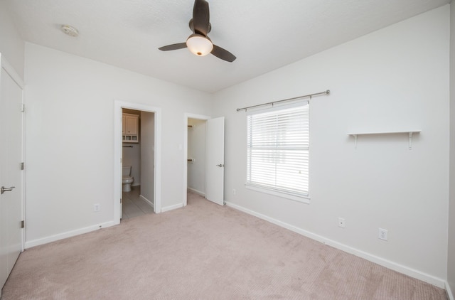 4311 Childress St, Houston, TX 77005 - unfurnished bedroom featuring baseboards, carpet, and connected bathroom