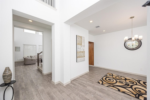 3330 Black Gore Creek Dr, Katy, TX 77494 - hall featuring wood finished floors, a chandelier, baseboards, stairway, and recessed lighting