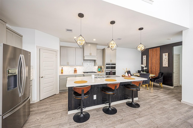 3330 Black Gore Creek Dr, Katy, TX 77494 - kitchen with appliances with stainless steel finishes, gray cabinets, and light wood-type flooring