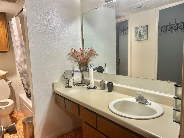 12660 Ashford Point Dr Unit 811, Houston, TX 77082 - bathroom with toilet, tile patterned floors, vanity, shower / bath combination with curtain, and a textured wall