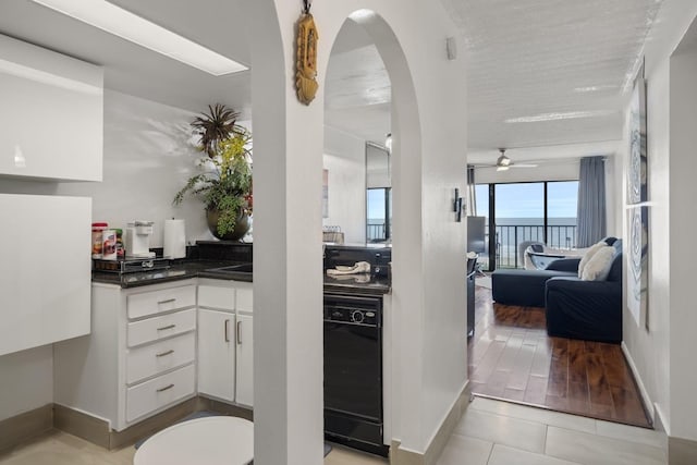 7310 Seawall Blvd Unit 309, Galveston, TX 77551 - bathroom with a ceiling fan, tile patterned floors, and baseboards