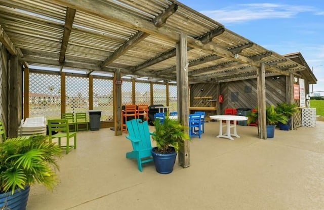 7310 Seawall Blvd Unit 309, Galveston, TX 77551 - view of patio / terrace with a pergola