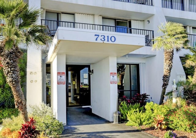 7310 Seawall Blvd Unit 309, Galveston, TX 77551 - entrance to property featuring stucco siding