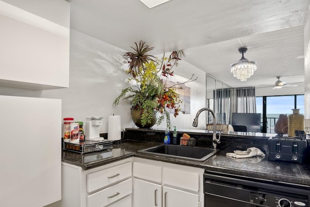 7310 Seawall Blvd Unit 309, Galveston, TX 77551 - kitchen with dishwasher, a sink, ceiling fan, white cabinets, and a chandelier