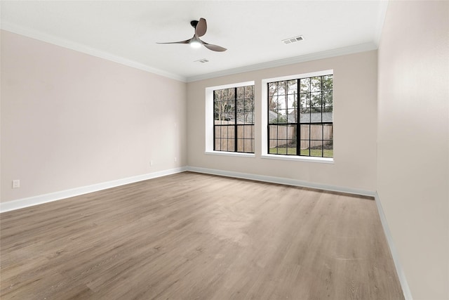 17819 Forest Park Ln, Spring, TX 77379 - spare room with wood finished floors, baseboards, a ceiling fan, and ornamental molding