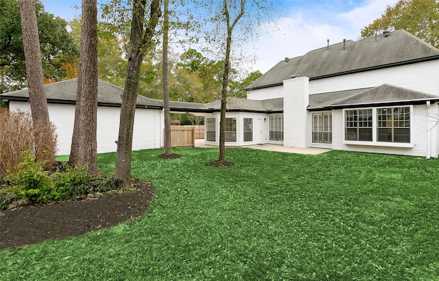 17819 Forest Park Ln, Spring, TX 77379 - back of house featuring a chimney and a patio area