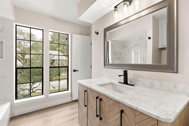 17819 Forest Park Ln, Spring, TX 77379 - bathroom with vanity, wood finished floors, and a marble finish shower