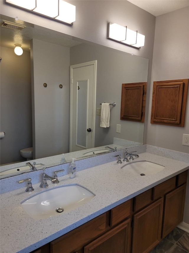 5515 Pimberton Ln, Spring, TX 77379 - bathroom featuring toilet and double vanity