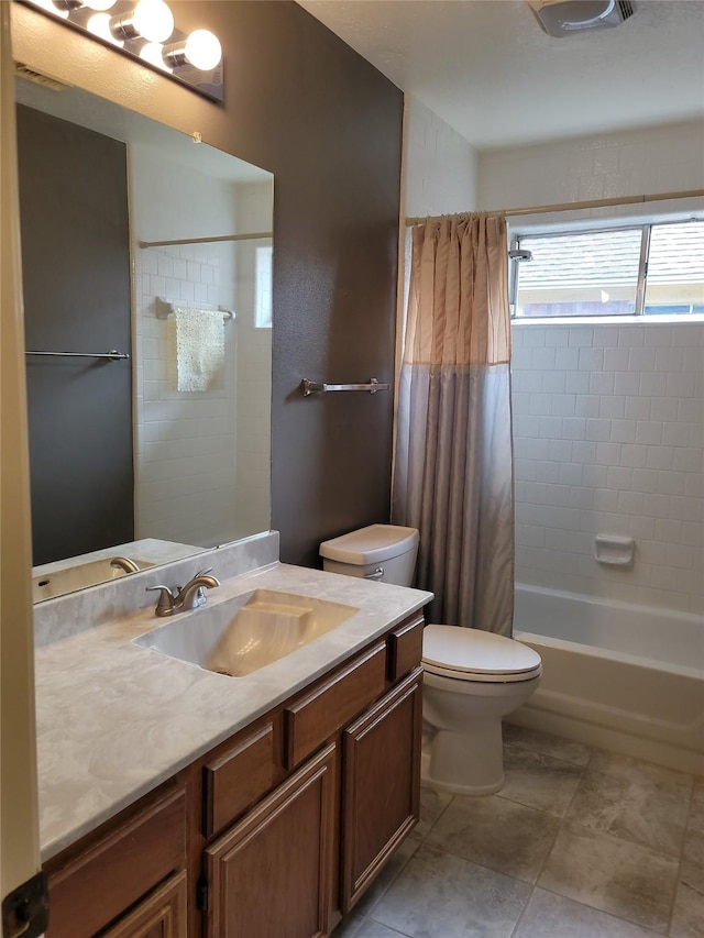 5515 Pimberton Ln, Spring, TX 77379 - bathroom featuring toilet, vanity, shower / bath combo with shower curtain, and tile patterned floors