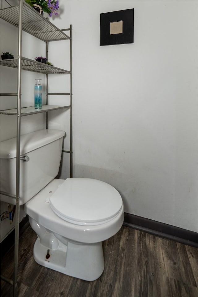 1933 Fm 1272, Grapeland, TX 75844 - bathroom featuring baseboards, toilet, and wood finished floors