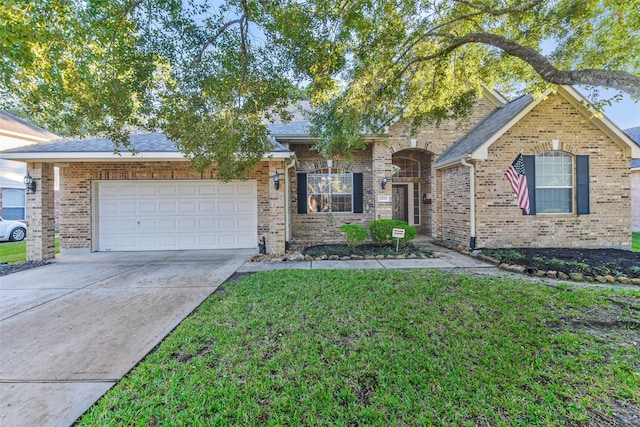 12202 Salt River Valley Ln, Humble, TX 77346 - view of front of property with concrete driveway, an attached garage, brick siding, and a front yard