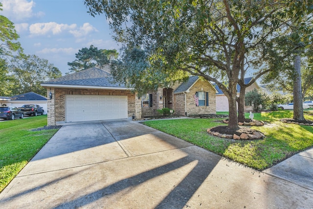12202 Salt River Valley Ln, Humble, TX 77346 - view of front of property featuring an attached garage, a front lawn, concrete driveway, and brick siding