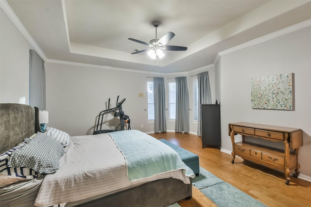 12202 Salt River Valley Ln, Humble, TX 77346 - bedroom with a raised ceiling, wood finished floors, baseboards, and ornamental molding