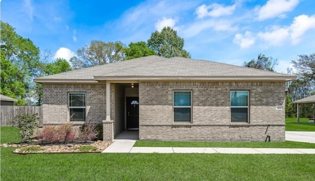 104 Tracie Dr, Dayton, TX 77535 - view of front of house with brick siding and a shingled roof