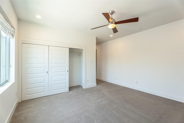 11502 Royal Tower Pl, Houston, TX 77082 - unfurnished bedroom with carpet floors, a closet, multiple windows, baseboards, and recessed lighting