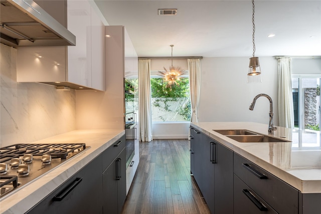 11502 Royal Tower Pl, Houston, TX 77082 - kitchen featuring a sink, range hood, stainless steel gas cooktop, dark wood-style flooring, and recessed lighting