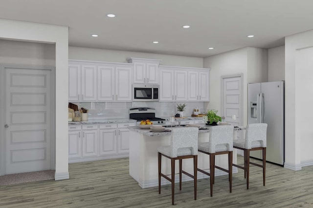 7515 Bristlegrass Colony Ct, Cypress, TX 77433 - kitchen with stainless steel appliances, white cabinetry, decorative backsplash, a kitchen breakfast bar, and recessed lighting