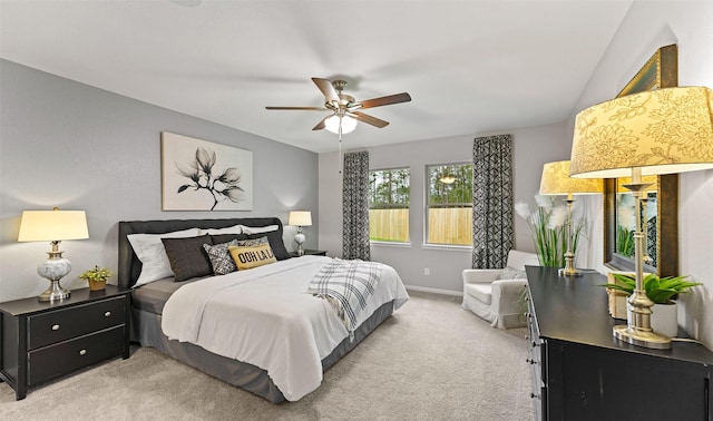 18817 Lucas Michael Way, New Caney, TX 77357 - bedroom featuring light carpet, baseboards, and ceiling fan