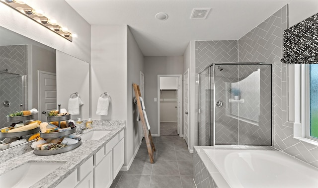 18817 Lucas Michael Way, New Caney, TX 77357 - full bath featuring double vanity, a shower stall, a bath, and tile patterned floors