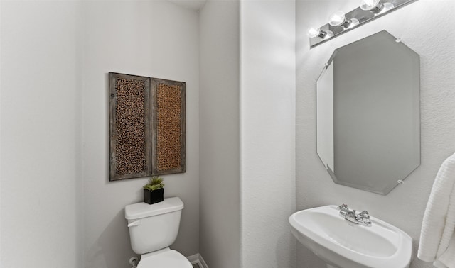 18817 Lucas Michael Way, New Caney, TX 77357 - half bathroom with a sink and toilet