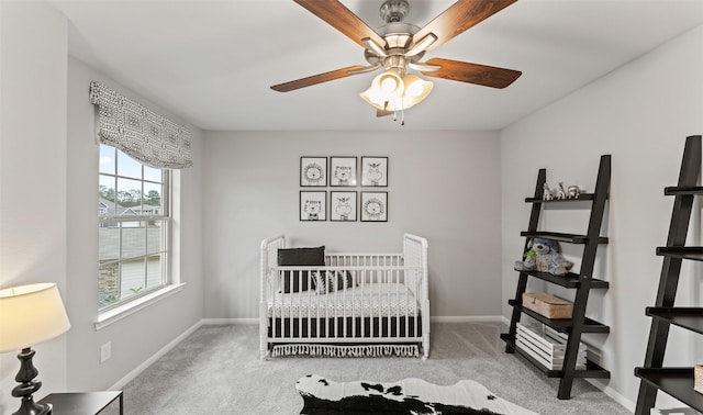 18817 Lucas Michael Way, New Caney, TX 77357 - carpeted bedroom featuring baseboards and ceiling fan