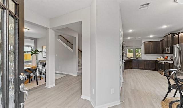 18817 Lucas Michael Way, New Caney, TX 77357 - foyer with light wood finished floors, stairs, baseboards, and recessed lighting