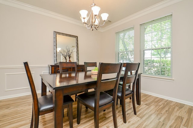 4134 Foxbrush Ln, Sugar Land, TX 77479 - dining room featuring a chandelier, ornamental molding, light wood-style floors, and baseboards