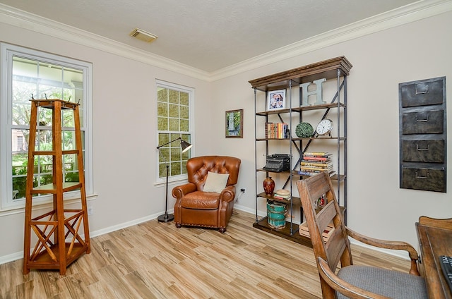 4134 Foxbrush Ln, Sugar Land, TX 77479 - sitting room featuring light wood-style floors, crown molding, and baseboards