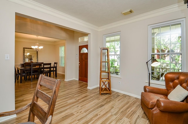 4134 Foxbrush Ln, Sugar Land, TX 77479 - foyer with a chandelier, light wood-type flooring, ornamental molding, and baseboards