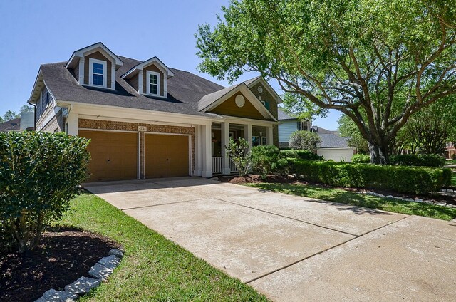 4134 Foxbrush Ln, Sugar Land, TX 77479 - view of front of house featuring concrete driveway, a garage, brick siding, and a shingled roof