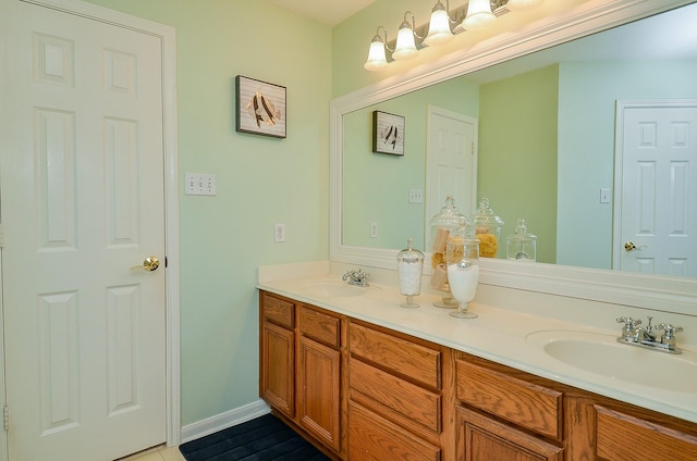 4134 Foxbrush Ln, Sugar Land, TX 77479 - bathroom with double vanity and baseboards