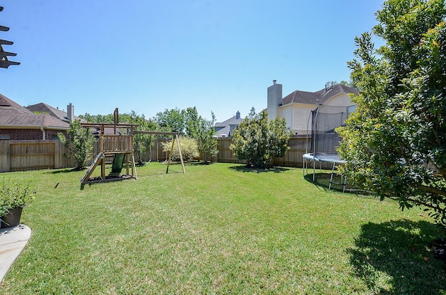 4134 Foxbrush Ln, Sugar Land, TX 77479 - view of yard featuring a trampoline and a playground