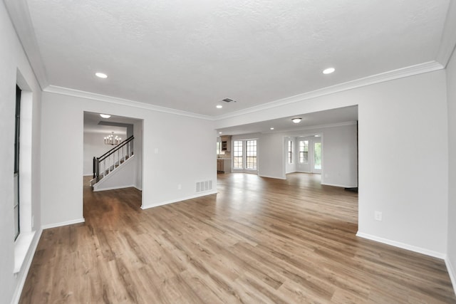 7622 Shangrila Ln, Houston, TX 77095 - unfurnished living room with wood finished floors, baseboards, a chandelier, crown molding, and recessed lighting