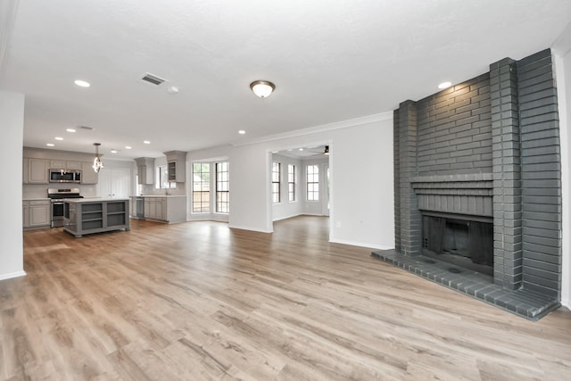 7622 Shangrila Ln, Houston, TX 77095 - unfurnished living room featuring baseboards, a fireplace, light wood-type flooring, recessed lighting, and ornamental molding