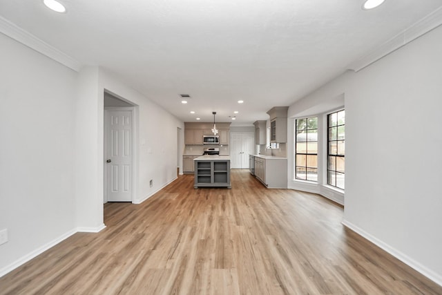 7622 Shangrila Ln, Houston, TX 77095 - unfurnished living room with recessed lighting, baseboards, light wood-style flooring, ornamental molding, and a sink