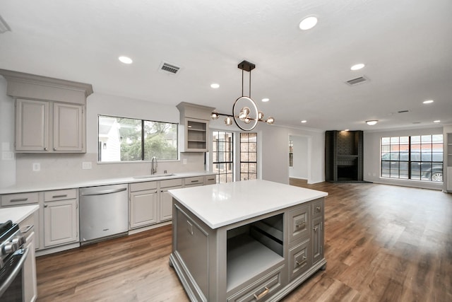 7622 Shangrila Ln, Houston, TX 77095 - kitchen with stainless steel appliances, gray cabinetry, a sink, plenty of natural light, and recessed lighting