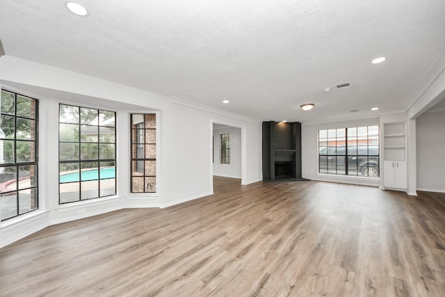 7622 Shangrila Ln, Houston, TX 77095 - unfurnished living room with a fireplace, baseboards, recessed lighting, and wood finished floors