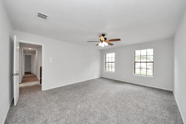 7622 Shangrila Ln, Houston, TX 77095 - spare room featuring attic access, carpet flooring, ceiling fan, and baseboards