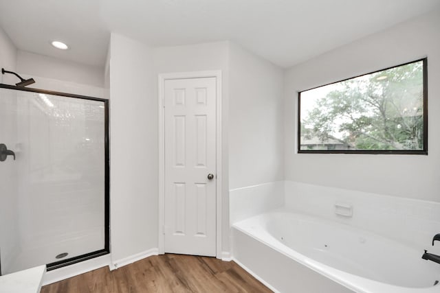7622 Shangrila Ln, Houston, TX 77095 - full bath featuring a shower stall, a jetted tub, wood finished floors, and baseboards