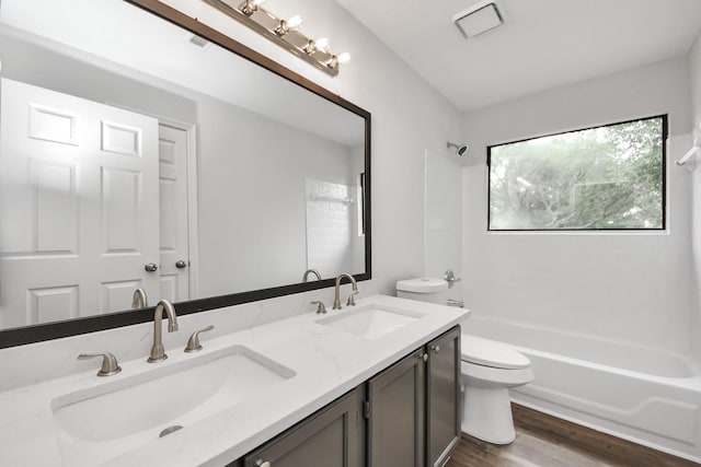 7622 Shangrila Ln, Houston, TX 77095 - full bath with toilet, double vanity, shower / bath combination, and wood finished floors
