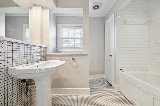 6649 Fairfield St, Houston, TX 77023 - full bath with tile patterned floors and ornamental molding