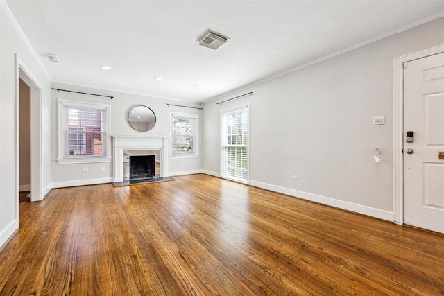 6649 Fairfield St, Houston, TX 77023 - unfurnished living room with plenty of natural light, wood finished floors, baseboards, and ornamental molding