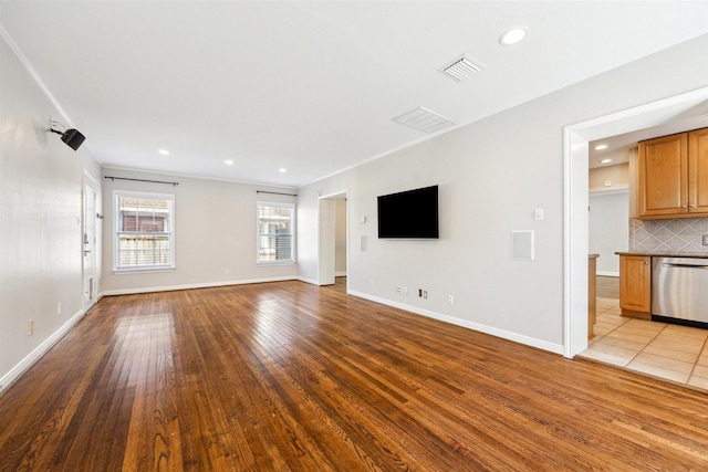 6649 Fairfield St, Houston, TX 77023 - unfurnished living room with hardwood / wood-style flooring, recessed lighting, and baseboards