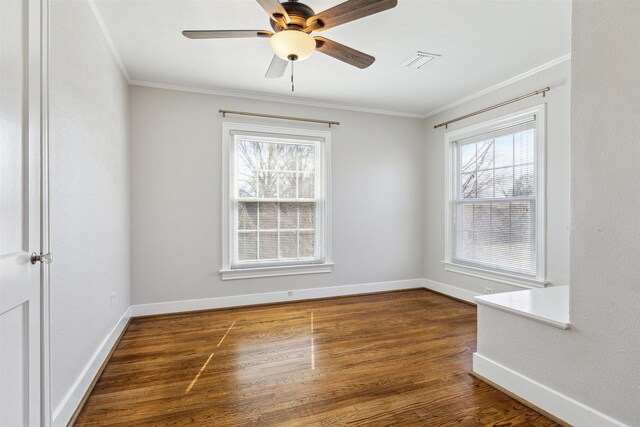 6649 Fairfield St, Houston, TX 77023 - empty room with ornamental molding, plenty of natural light, wood finished floors, baseboards, and ceiling fan