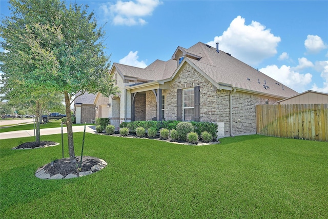 28111 Middlewater View Ln, Katy, TX 77494 - view of front facade featuring brick siding, driveway, and a shingled roof